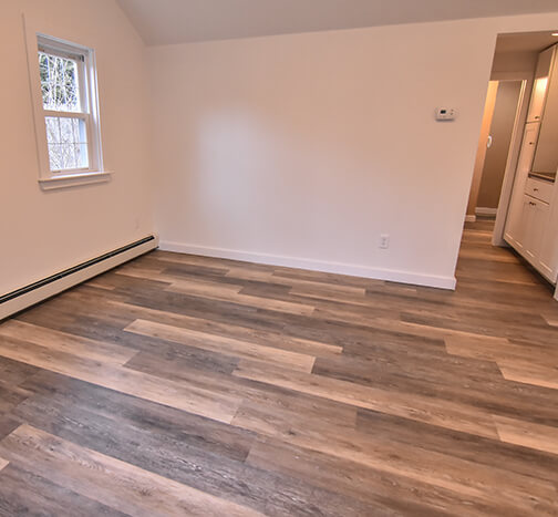 renovated room with new hardwood floor and fresh paint