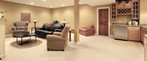 newly remodeled basement with kitchen and entertainment center