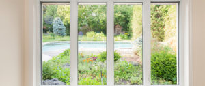 picture window with beautiful backyard view